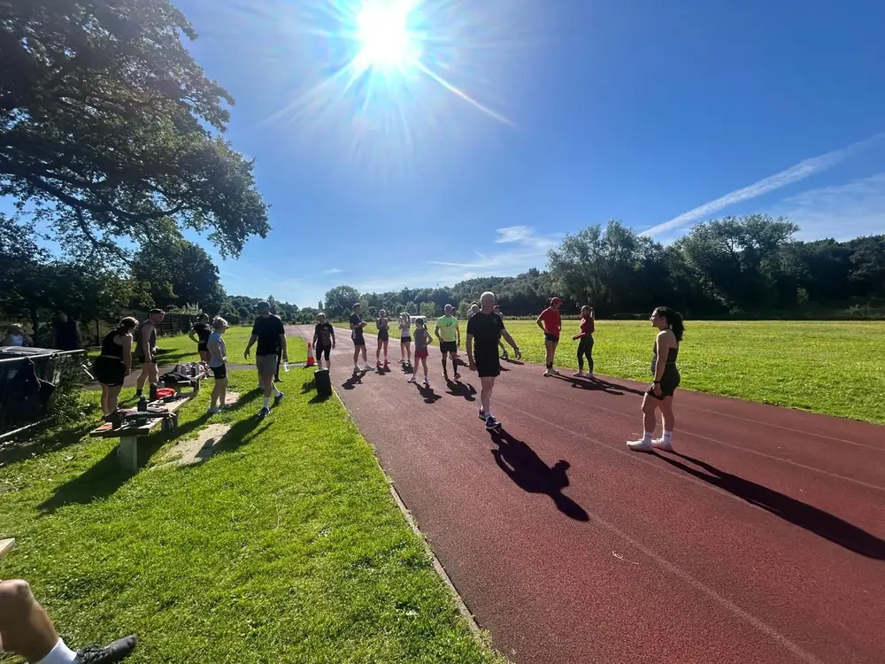Excape members running on the track in the morning