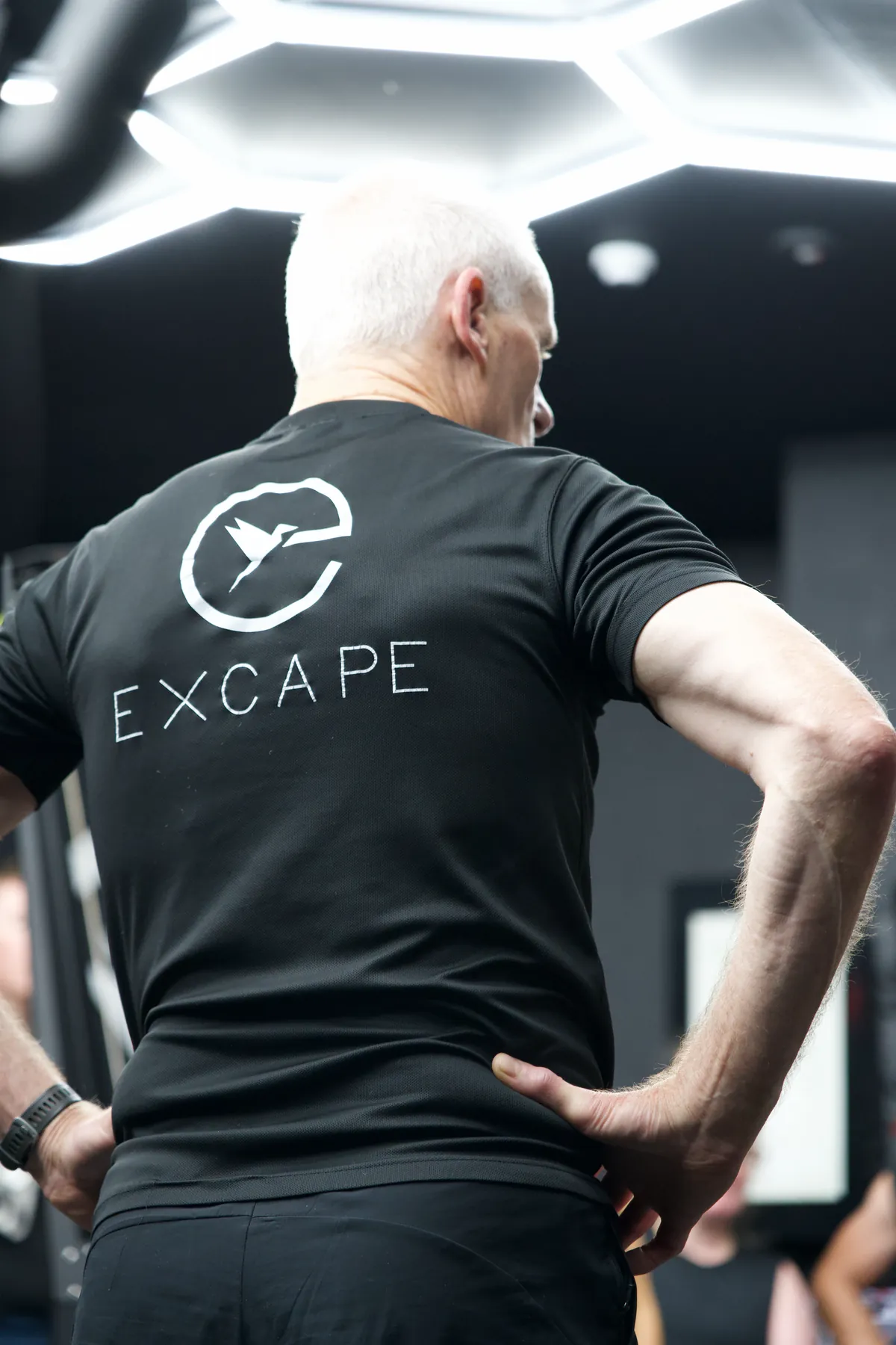 An Excape member on the studio floor between sets