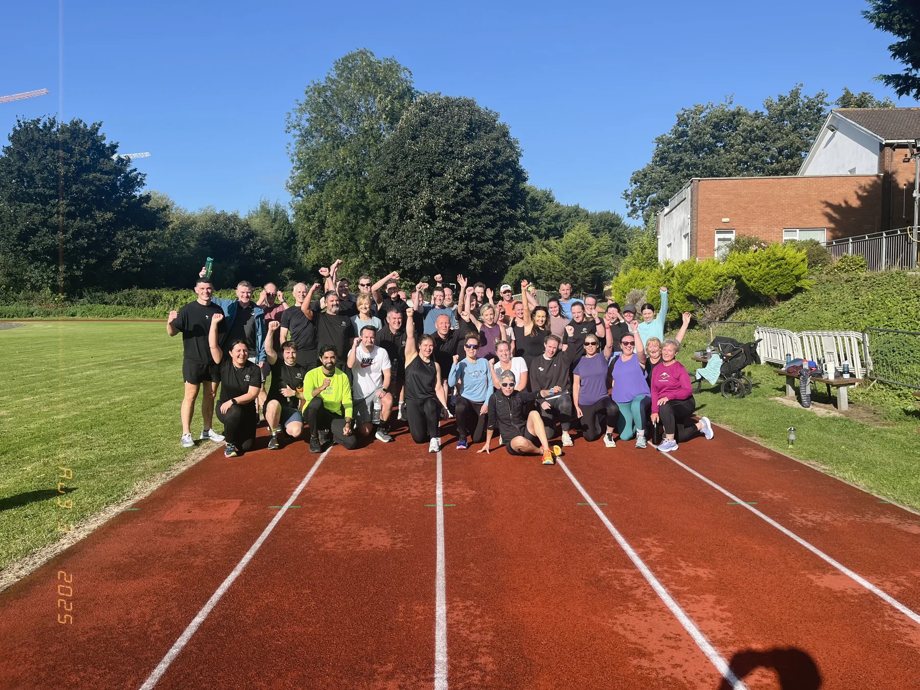 Excape members together after a group session on the track